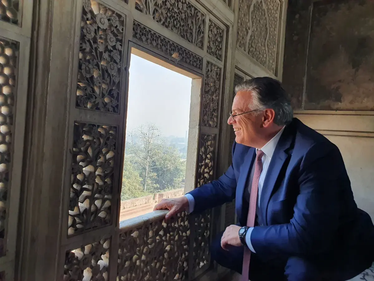 International visitor exploring carved Mughal architecture at Lahore Fort