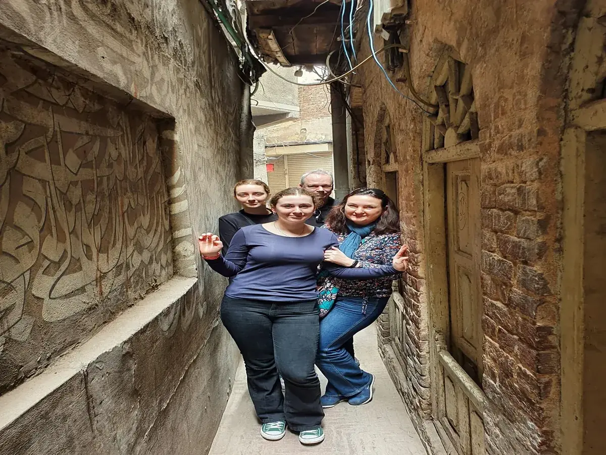 International guests walking through a narrow lane in Lahore Walled City