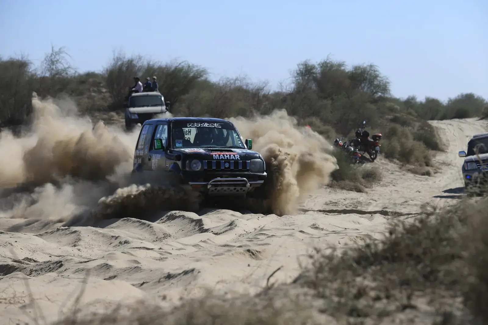 4x4 vehicle racing through sand during the Cholistan Desert Jeep Rally