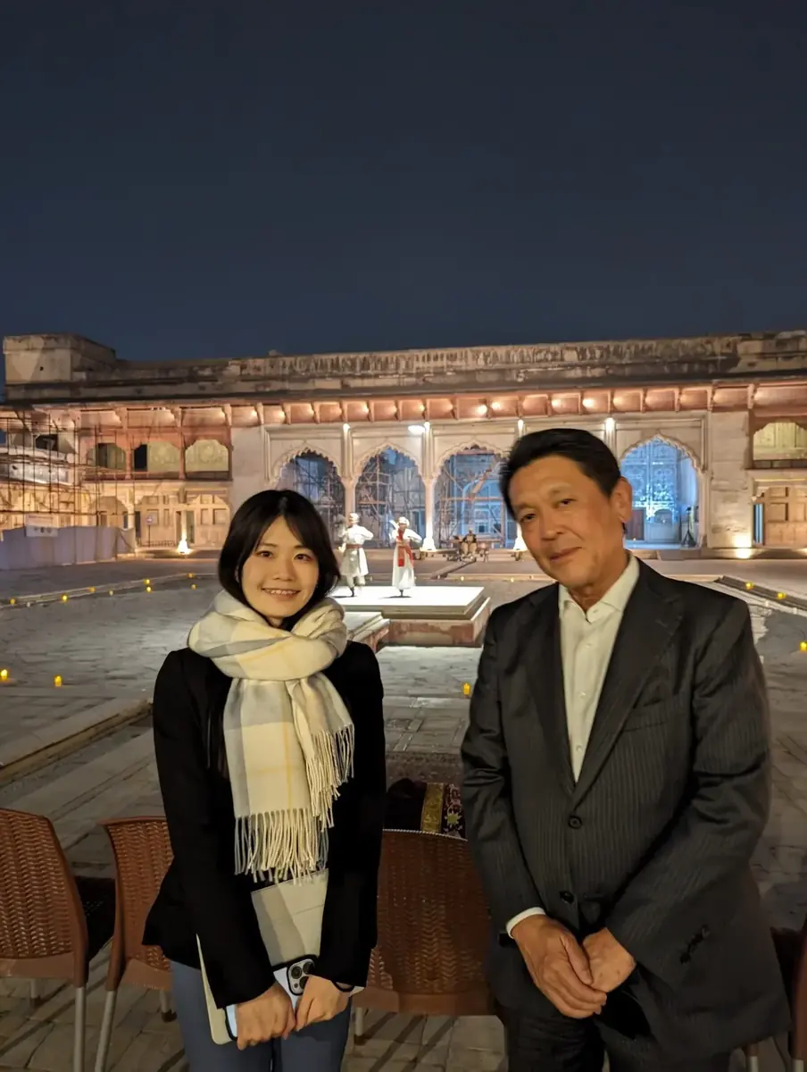 International visitors at an evening cultural experience inside Lahore Fort